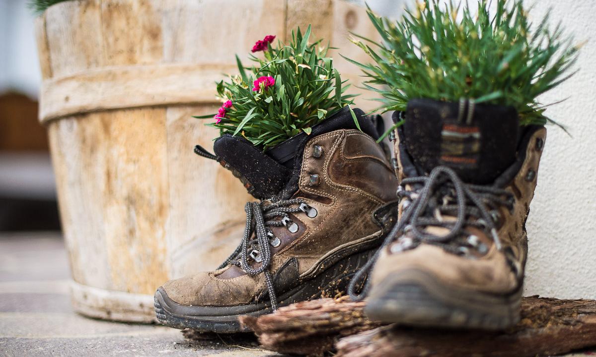 Hiking boots panted with flowers
