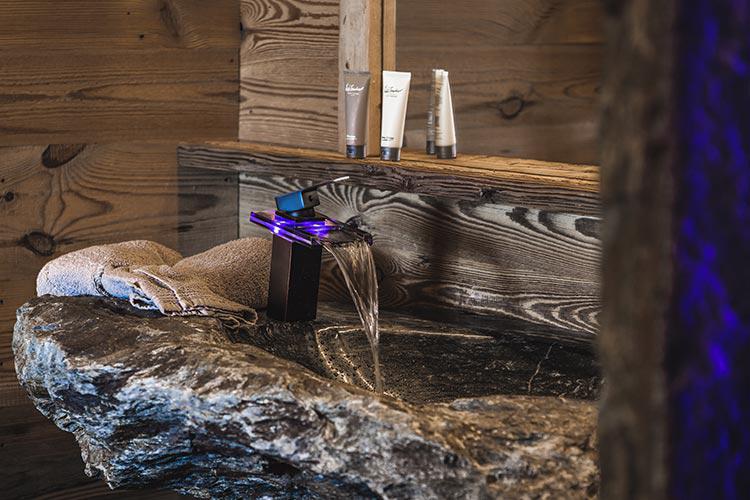 Bath with deluxe shower as well as washbasin made from stone found on our property